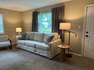 a living room with a couch and a window at Cute & Cozy 2 Bedroom Near Park in Midland