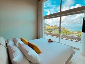 Ένα ή περισσότερα κρεβάτια σε δωμάτιο στο Duplex luxueux avec jacuzzi privé et vue mer à Saint-Martin - FR-1-734-64 +14 φωτογραφίες