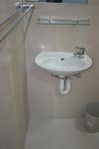 a bathroom with a white sink in a room at The Gem Guest House & Spa in Parow +12 photos