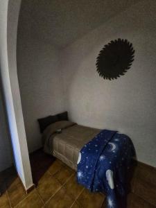 a bedroom with a bed and a mirror on the wall at Eddys Home in Bacu Abis +2 photos