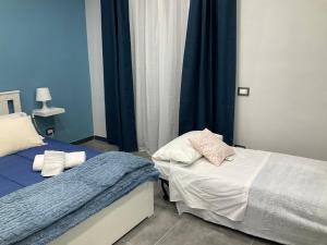 Letto o letti in una camera di Siculahome23