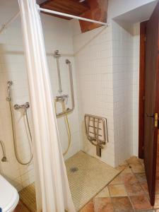 a bathroom with a shower and a toilet at Casa Blava in Castelló d'Empúries +24 photos