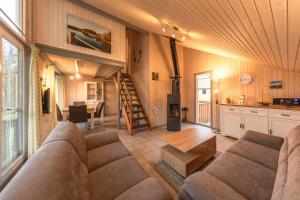 a living room with a couch and a table at Wildgans 65 in Mirow