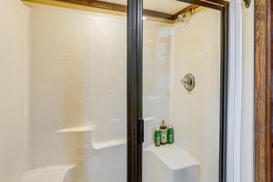 a shower with a glass door next to a shower at On-Site Trails and Furnished Deck Monteagle Escape! in Monteagle +21 photos