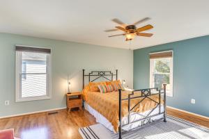 a bedroom with a bed and a ceiling fan at 6 Mi to Dtwn Family-Friendly Home in Annapolis! in Annapolis