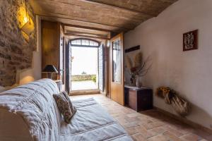 Кровать или кровати в номере Appartamento nel Castello presso Gubbio