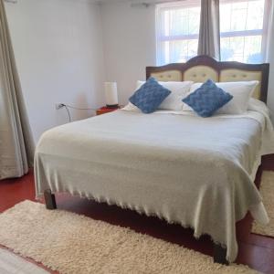 Ένα ή περισσότερα κρεβάτια σε δωμάτιο στο Homestay Pumagui