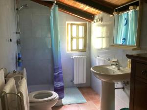 a bathroom with a sink toilet and a window at Villa Pietrafiore in Monterosso al Mare