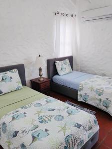 Postel nebo postele na pokoji v ubytování Villa Hanna