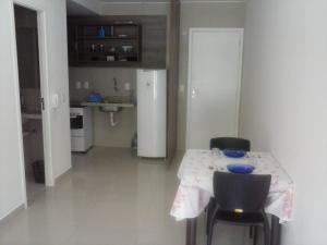 A cozinha ou cozinha compacta de VG Fun Residence