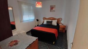 Postel nebo postele na pokoji v ubytování Casa Alquiler temporario garage y patio