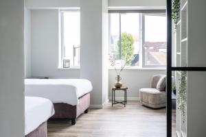 En eller flere senge i et værelse på Comfortable Room w Private Bathroom & Fast WiFi