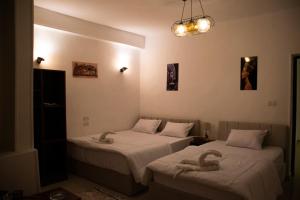 Letto o letti in una camera di Keeper Pyramids View INN