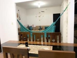a hammock in a living room with a couch at CASA EN CONDOMINIO d3 MANU in Trinidad