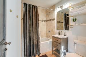 a bathroom with a tub and a toilet and a sink at Walk to Lifts Copper Mtn Condo in Center Village in Frisco +23 photos