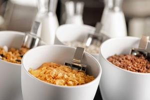 a group of bowls of food on a table at AC Hotel by Marriott Tenerife in Santa Cruz de Tenerife