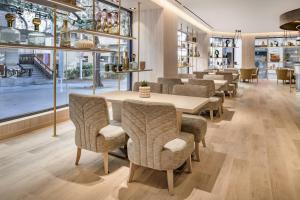 a dining room with a table and chairs at AC Hotel by Marriott Tenerife in Santa Cruz de Tenerife