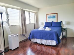 En eller flere senge i et værelse på Royal Aloha 1207