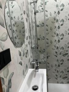 a bathroom with a sink and a mirror at LOFT LA LUNA in Villanueva del Arzobispo +21 photos