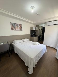 Ένα ή περισσότερα κρεβάτια σε δωμάτιο στο Flat para 2 Pessoas no Move Tambaú!