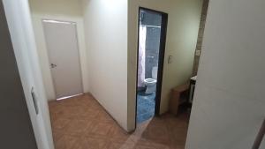 a hallway with a bathroom with a toilet and a mirror at Mendoza-Espaciosa habitación con baño privado in Godoy Cruz +21 photos