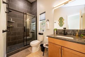 a bathroom with a toilet and a shower and a sink at 2 New Homes, Dome Bedroom stars, Climbing Wall Zion Bryce BBQ Firepit in Glendale +79 photos