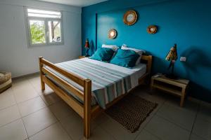 Una cama o camas en una habitación de Bas de villa le rêve éveillé