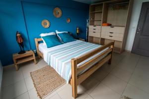 Una cama o camas en una habitación de Bas de villa le rêve éveillé