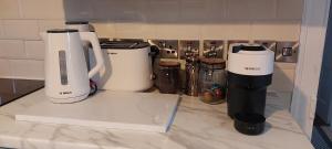 a group of appliances sitting on top of a counter at A Classic Donegal Townhouse in Donegal +7 photos