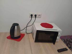a microwave with a red heart on top of it at Nea Iskra Vyletska Berezhanska street in Lviv +15 photos