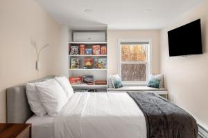 Ένα ή περισσότερα κρεβάτια σε δωμάτιο στο Modern Private Stay with Luxury Amenities