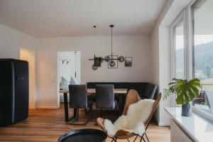 a dining room with a table and chairs at Schwarzwald Loft Panoramablick Menzenschwand in St. Blasien