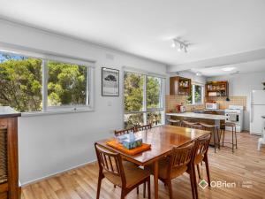 a kitchen and dining room with a table and chairs at Ventnor Vintage Retreat in Ventnor