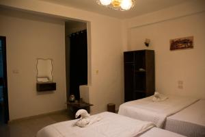 Letto o letti in una camera di Keeper Pyramids View INN