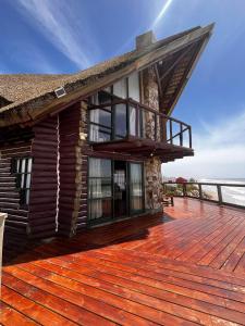 a house on a deck with a view of the ocean at La Proa in Aguas Dulces +15 photos