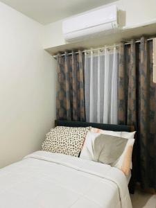 Postel nebo postele na pokoji v ubytování SMDC Shore 3 Residences