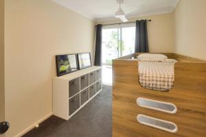 A television and/or entertainment centre at 164 Isle of Palms Resort