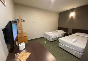 Voodi või voodid majutusasutuse Hotel Harbour Inn toas