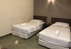 Voodi või voodid majutusasutuse Hotel Harbour Inn toas