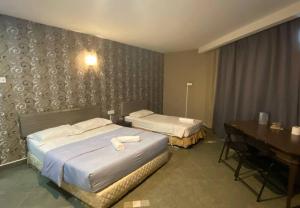 Voodi või voodid majutusasutuse Hotel Harbour Inn toas