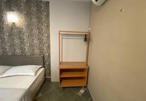 Voodi või voodid majutusasutuse Hotel Harbour Inn toas