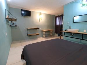 TV a/nebo společenská místnost v ubytování Casa Corazon Centro