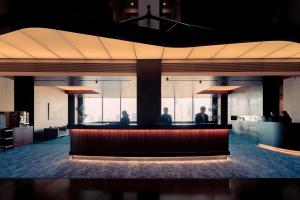 a lobby with a bar in the middle of a building at Park Hotel Tokyo in Tokyo