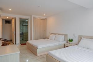 Letto o letti in una camera di Red Coral Hotel