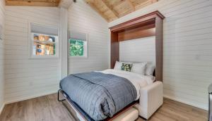 a bedroom with a bed in the corner of a room at Wildwood Resort and Marina in Gladdice