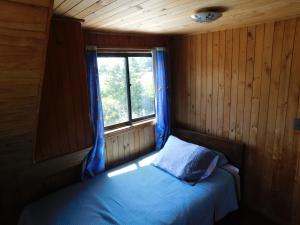 Ένα ή περισσότερα κρεβάτια σε δωμάτιο στο Cabaña Sector La Vaina, Lago Lanalhue