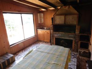 Ένα ή περισσότερα κρεβάτια σε δωμάτιο στο Cabaña Sector La Vaina, Lago Lanalhue