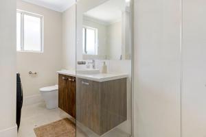 a bathroom with a sink and a toilet at Hill View Cottages - Sail B in Nannup +23 photos
