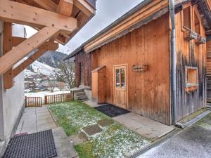 an entrance to a wooden building with a door at Chalet cosy proche du centre de Morzine avec parking - FR-1-524-131 in Morzine