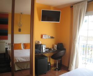 Postel nebo postele na pokoji v ubytování Boutique Hotel Pueblo